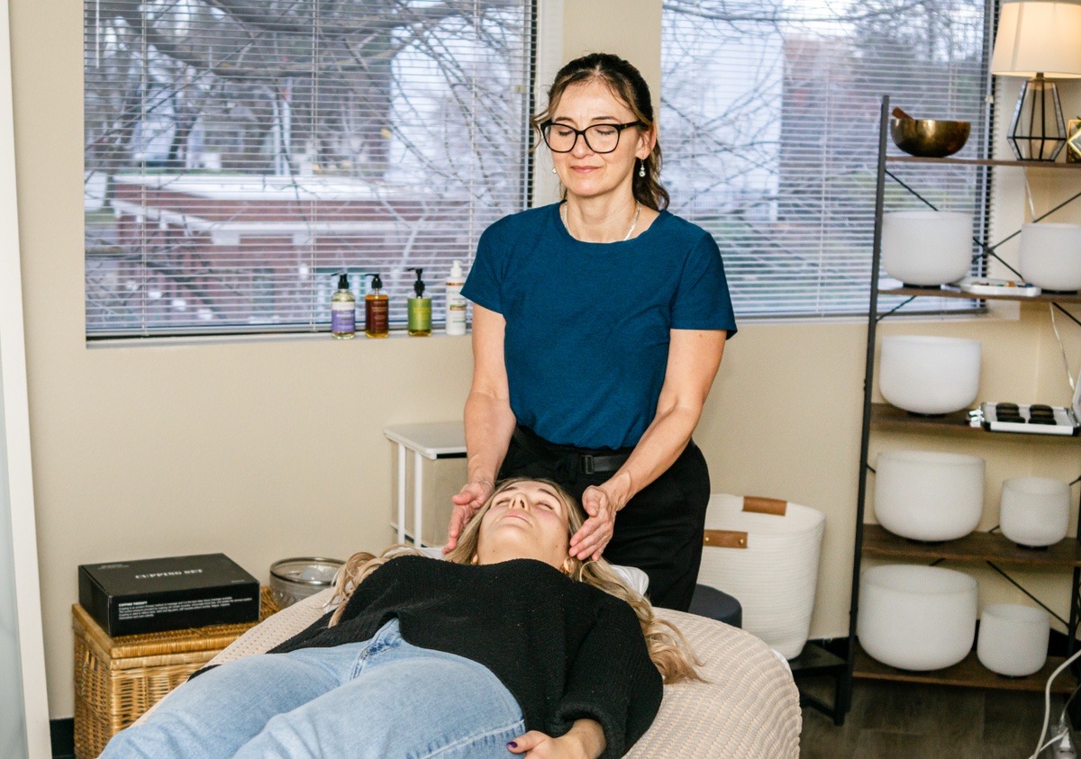 Christy offering a calm, supportive wellness session